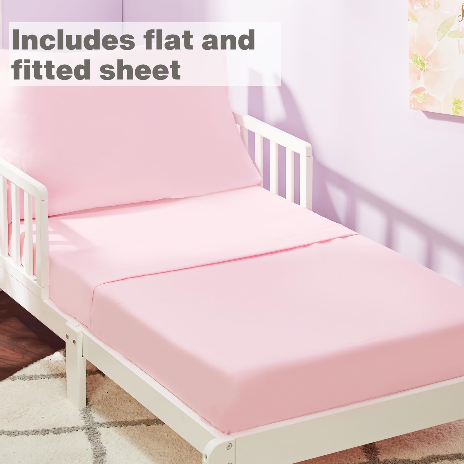 Everyday Kids pink fitted sheet fitting a standard toddler mattress with 8-inch pocket