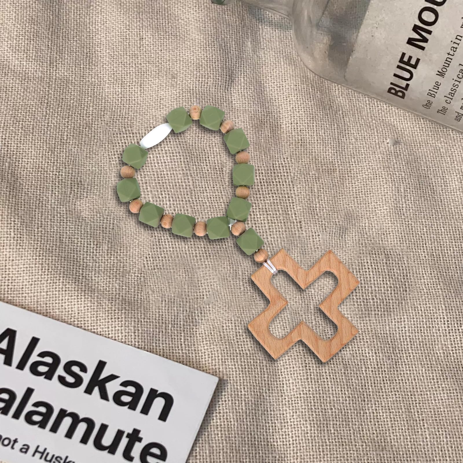 EVKILKJS baby shower supplies rosary teether doubles as decorative accent.