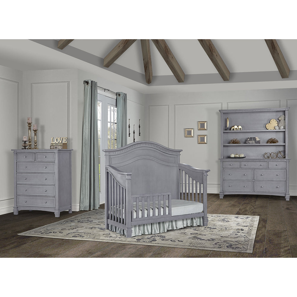 Evolur guard rail on crib shows solid wood durability and easy setup.