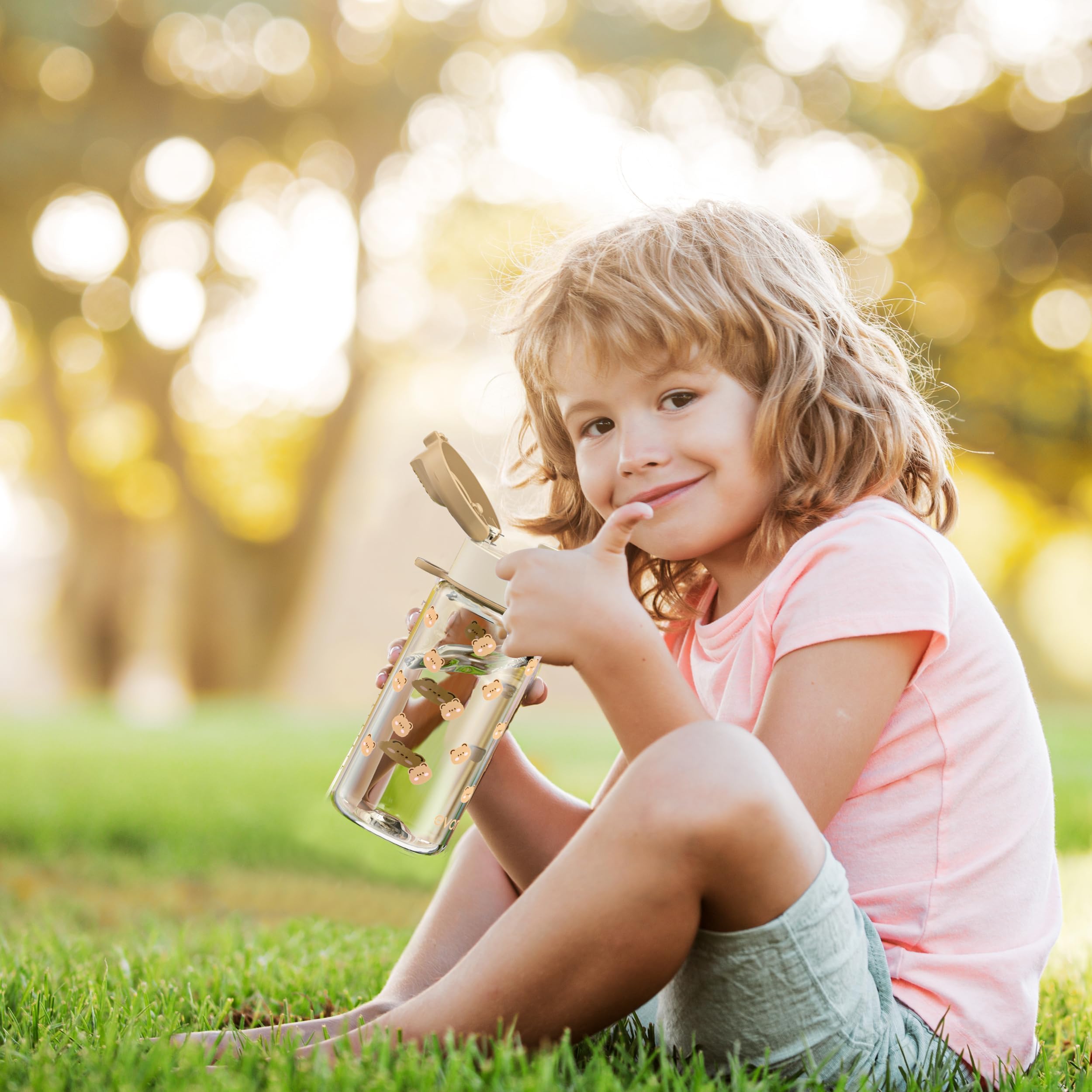 Evorie Tritan kids bottle held by child, lightweight for all-day carry.