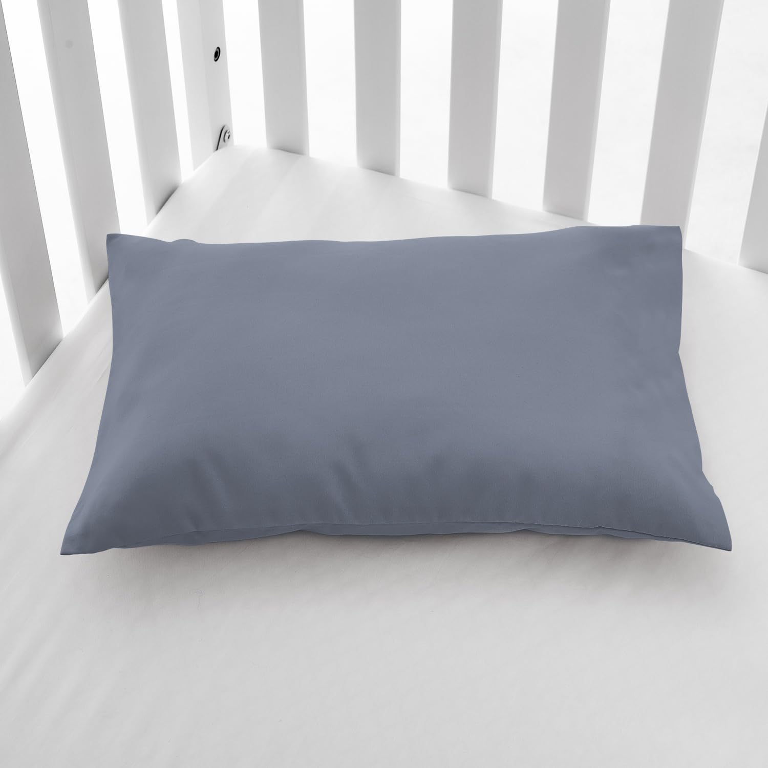 EXQ Home 13x18 blue-grey pillowcase on bed demonstrates versatile travel-ready sizing