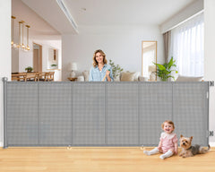 EZIGO 120-inch retractable gate extended across a wide doorway for child and pet safety.
