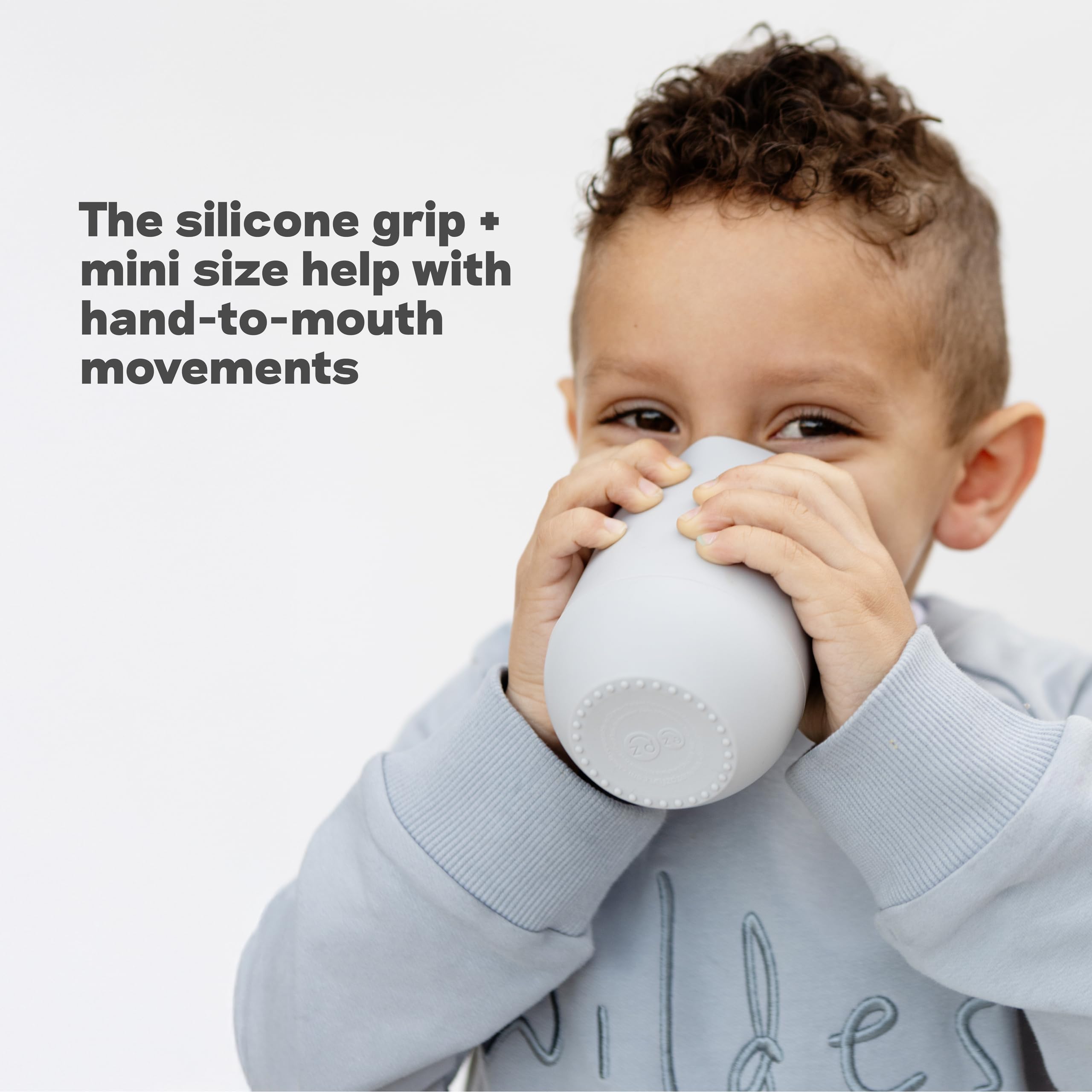 ezpz Happy Cup Sage dishwasher-safe silicone for easy cleaning after meals.