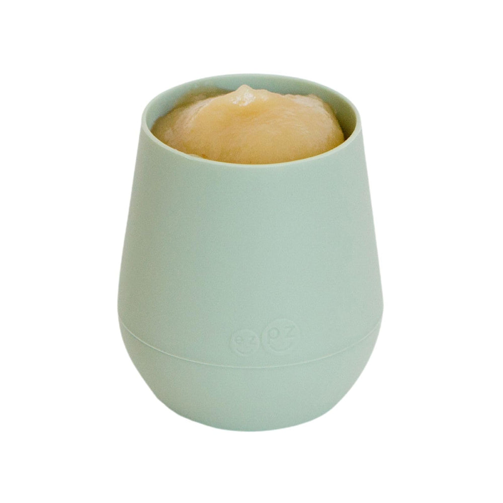 ezpz Tiny Cup Sage interior angle enables even flow for controlled drinking.