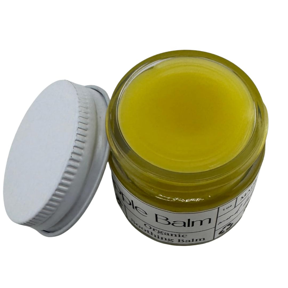 Easy application of Faith and Grace Organics nipple balm during breastfeeding for soothing relief