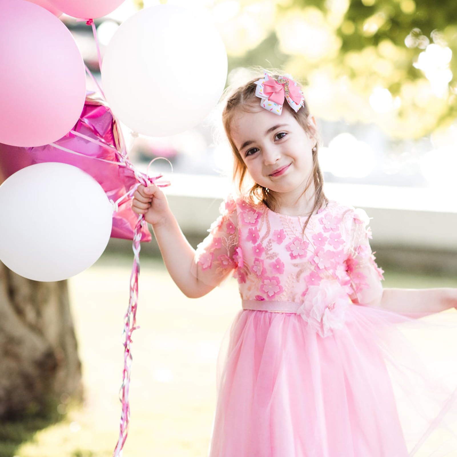 Fancheer pink donut ice-cream theme complements party outfits.