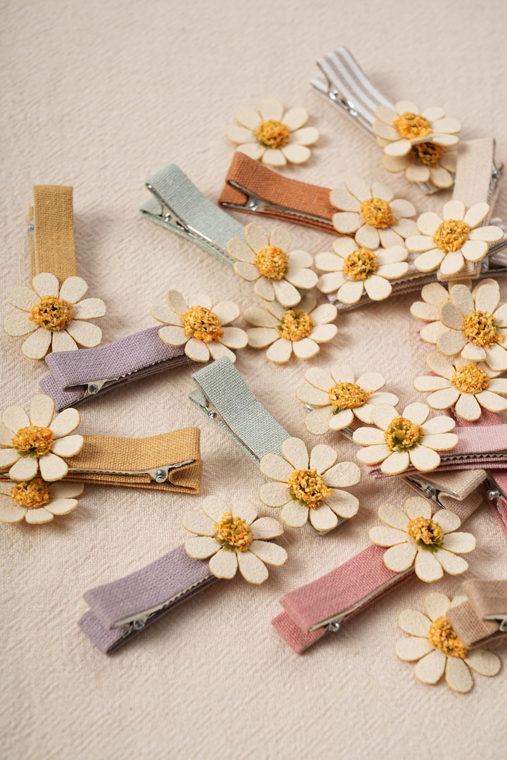 Fancy Clouds daisy hair clip worn on head demonstrates versatile styling.