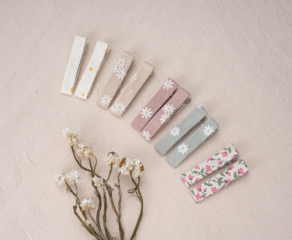 Fancy Clouds soft-petal fabric clip is lightweight for all-day wear.