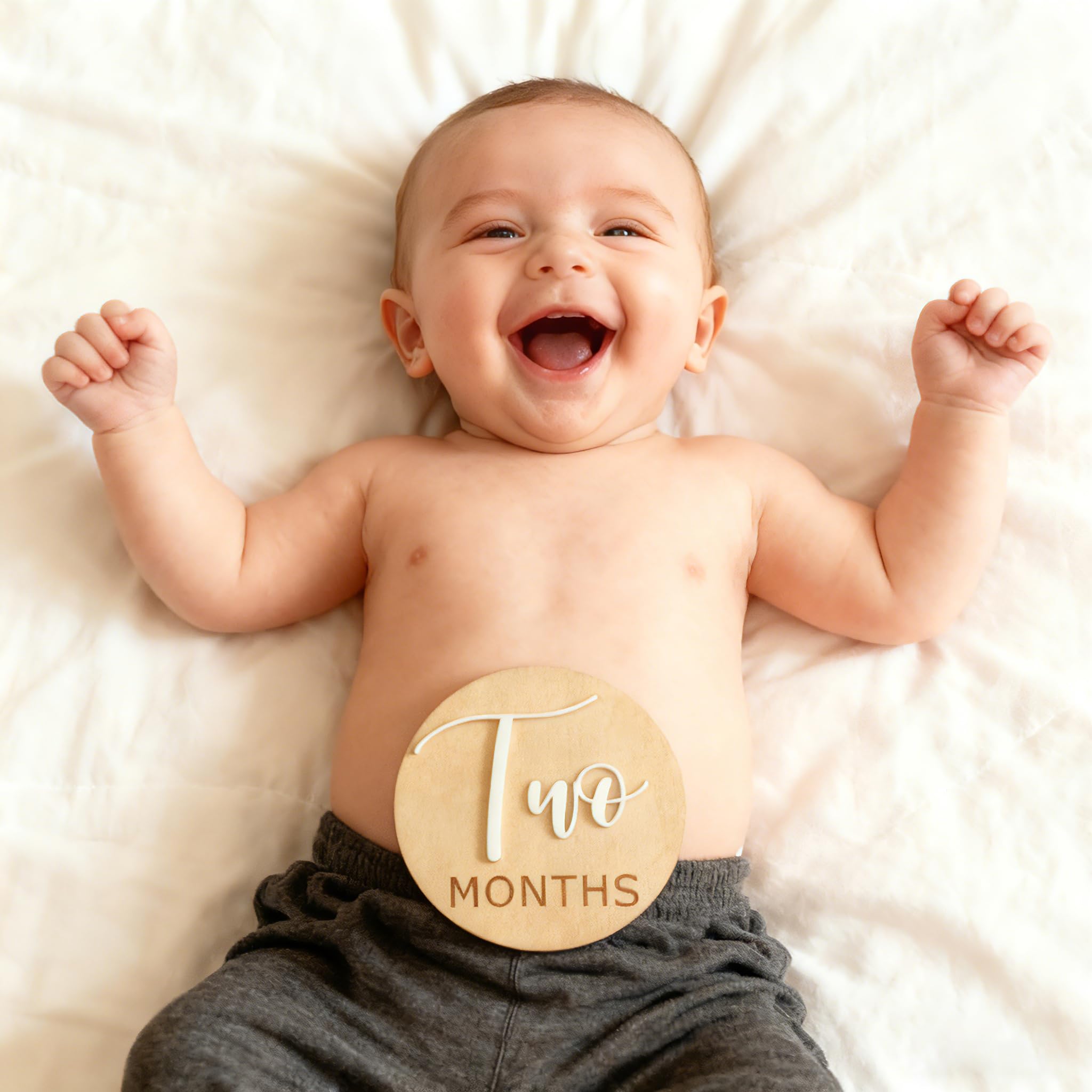 Fancy Swen monthly milestone gallery prop supports coordinated baby photos.