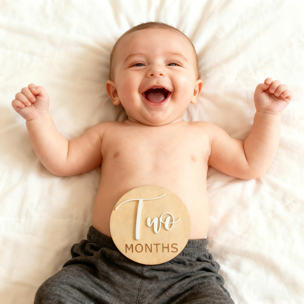Fancy Swen monthly milestone gallery prop supports coordinated baby photos.