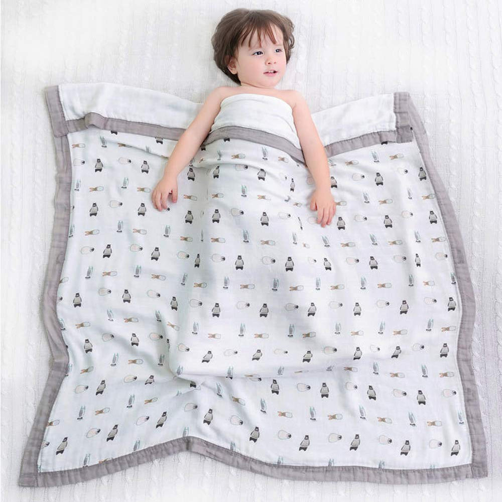 Farmer Mani swaddle gray nursing cover for on-the-go feeds.