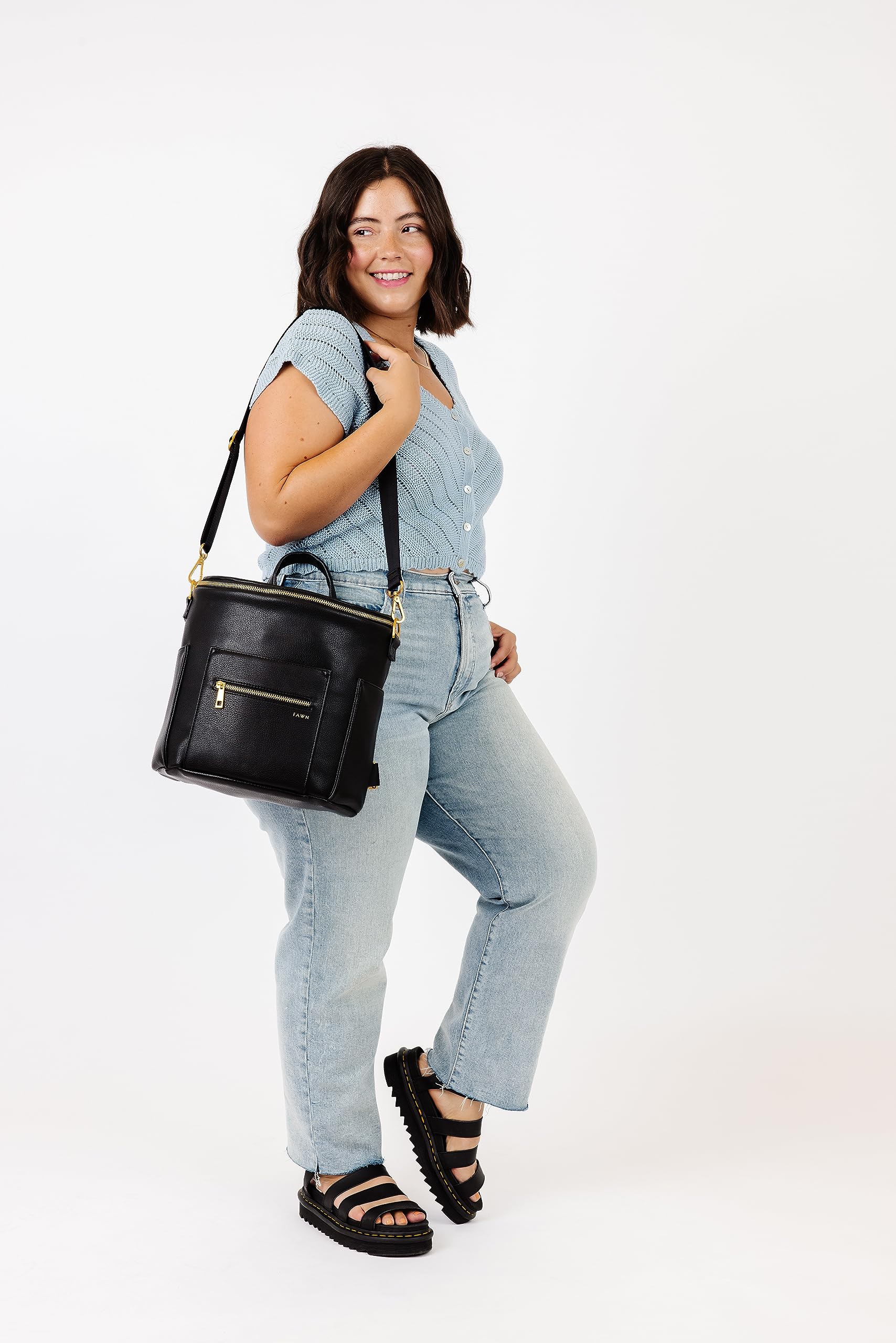 FAWN DESIGN Mini Diaper Bag in use, adaptable for various family outings.
