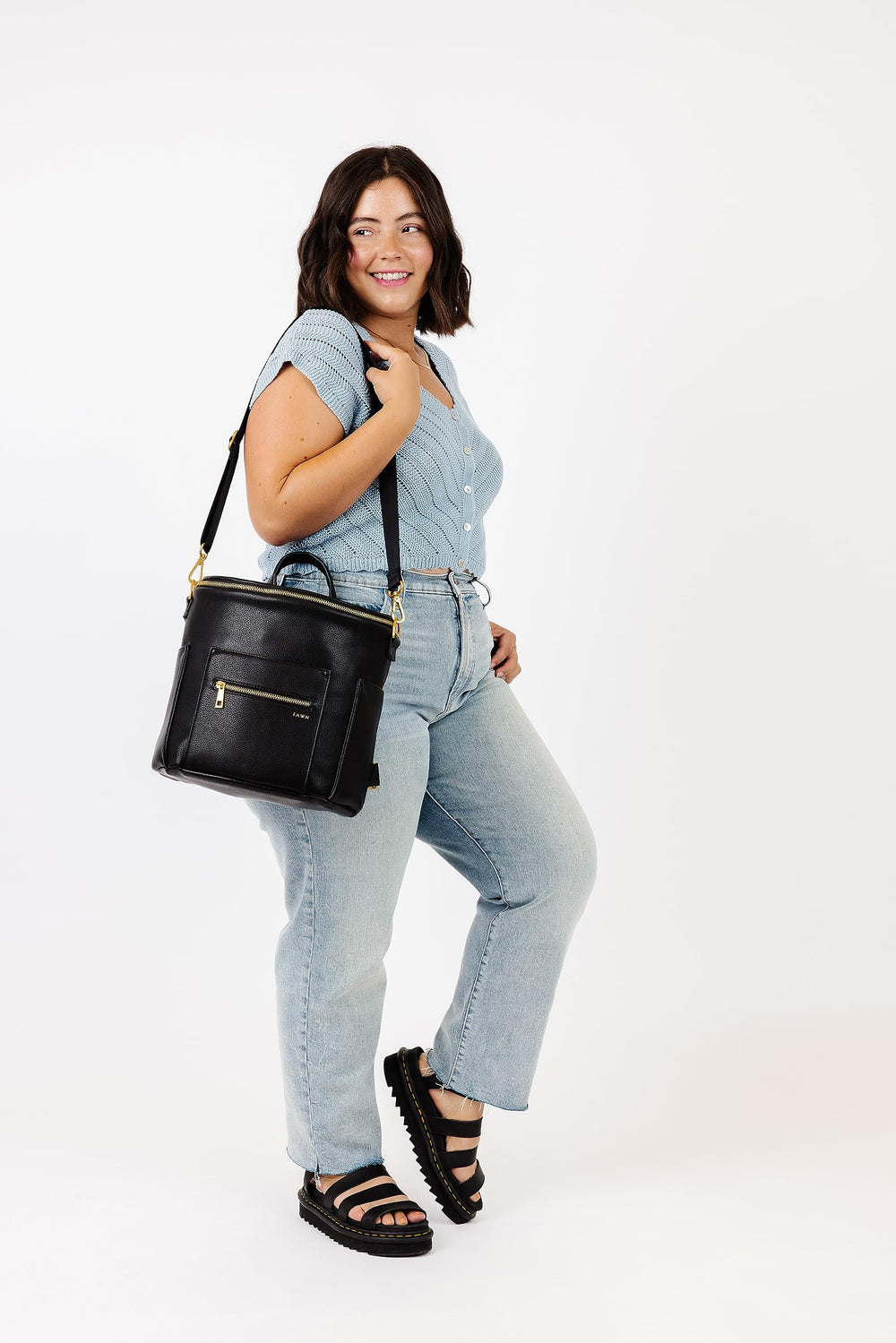 FAWN DESIGN Mini Diaper Bag in use, adaptable for various family outings.