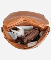 FAWN DESIGN backpack side pocket for easy bottle or accessory access.