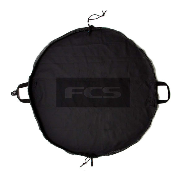 FCS Change Mat rolled for compact storage, ideal for portable wetsuit changes
