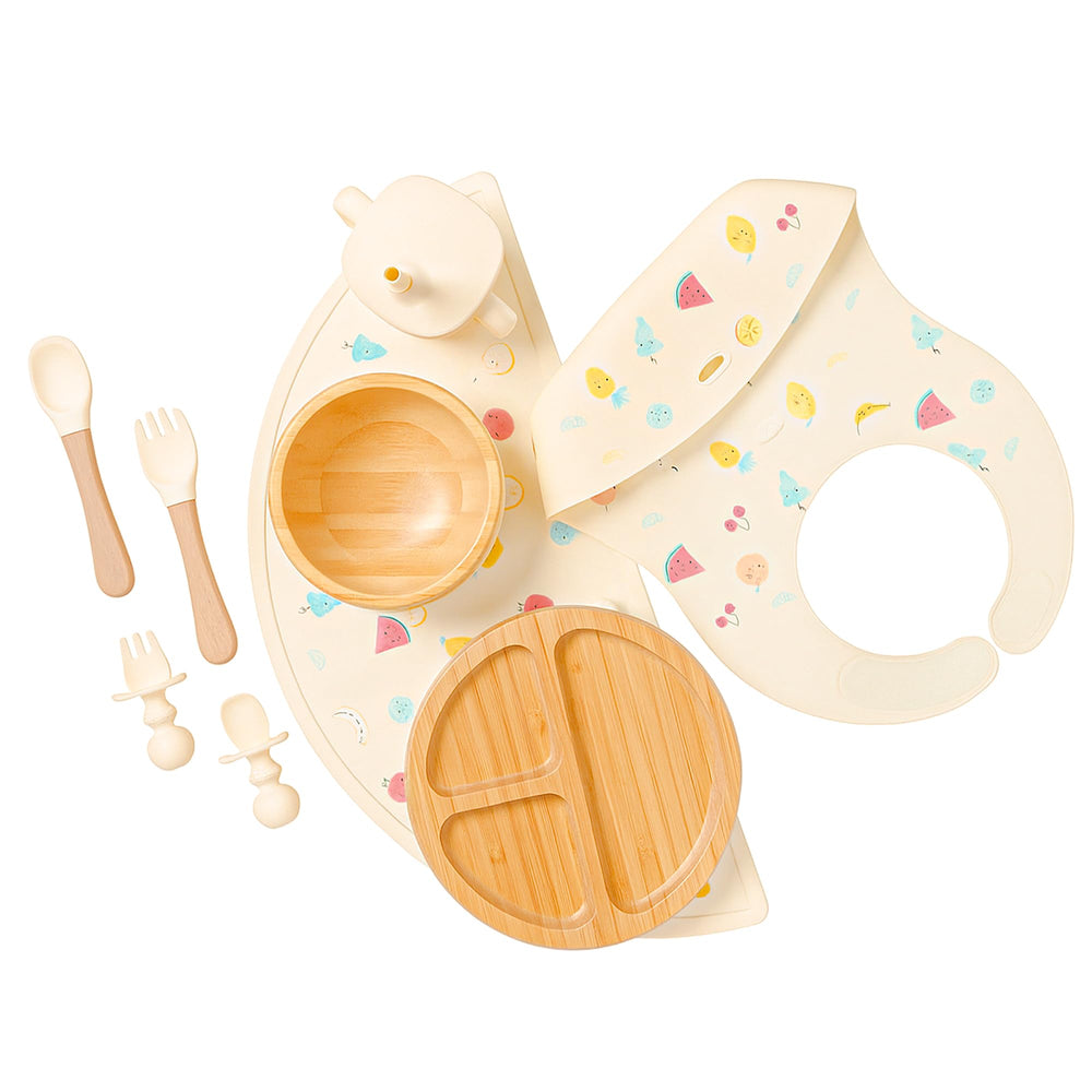 Feed Me Fun bamboo suction plate on a high chair tray reduces spills.