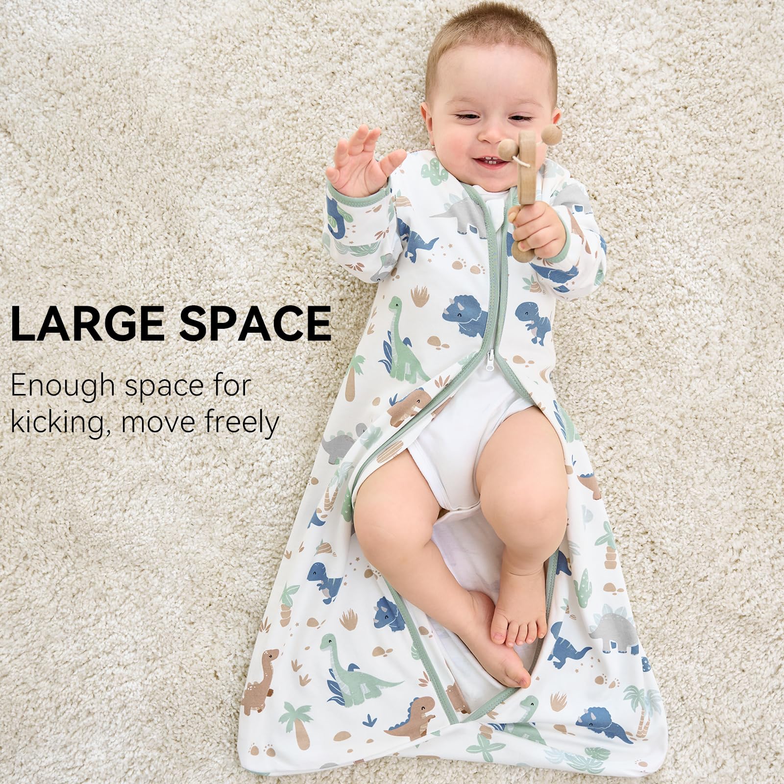 FIEMOL baby wearing a green dinosaur sleep sack for resting