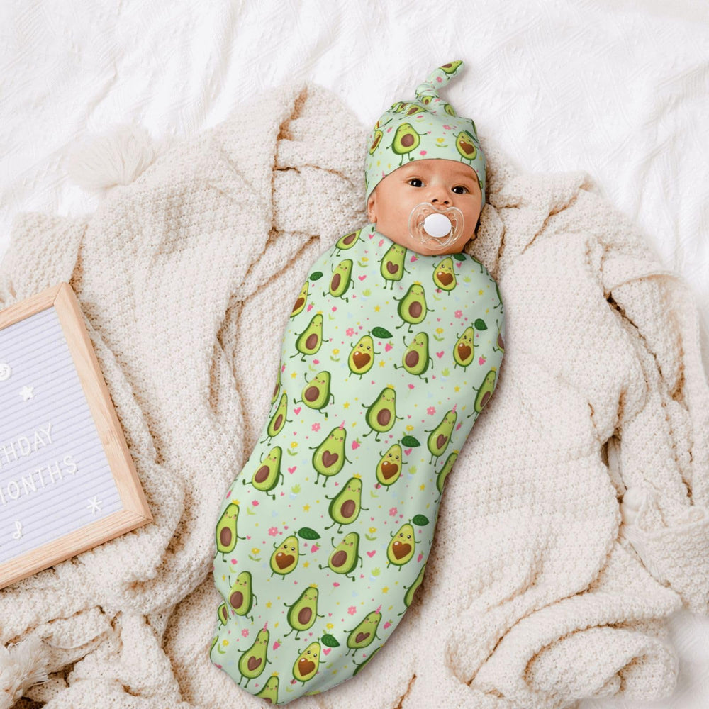 Figtihw Avocado Swaddle Blanket on baby, showcasing unisex look.