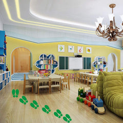 Finduat green footprint floor decals mark dance studio paths for easy movement.