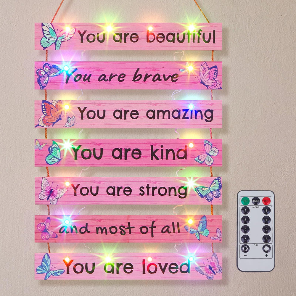 fiobee pink butterfly wall decor with LED light adds a cheerful accent to teen girls' room.