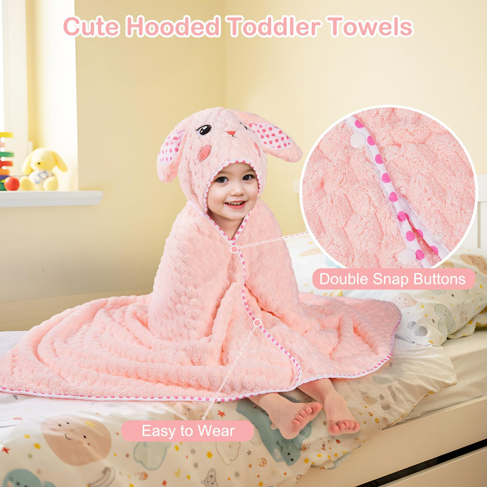 Fiobee wearable towel with two buttons stays in place during play.