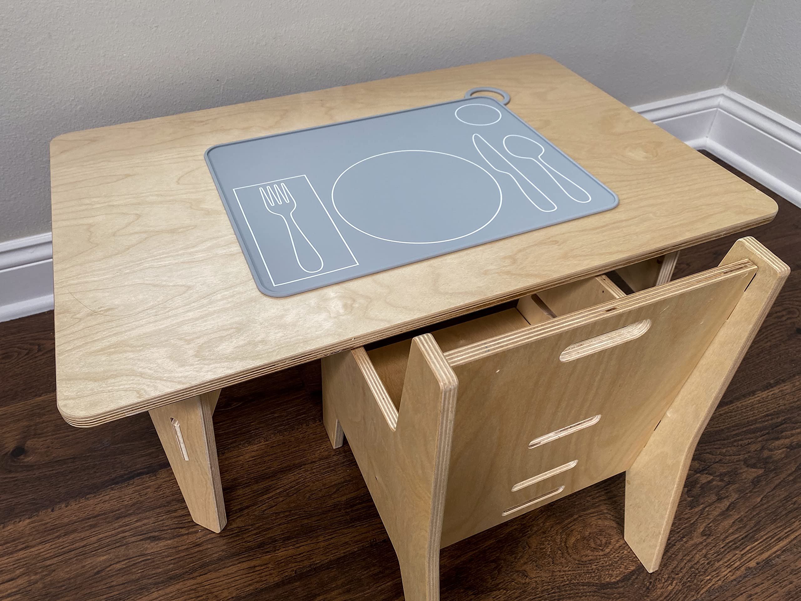 Fire Rooster Kids placemat on table during family dinner promotes independence