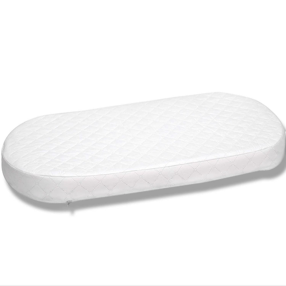 First Essentials bassinet mattress ready for setup with a snug base.
