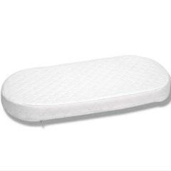 First Essentials bassinet mattress ready for setup with a snug base.