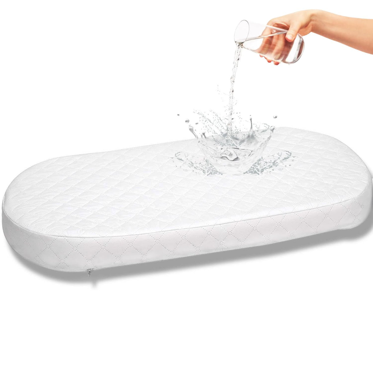 First Essentials bassinet mattress pad front view demonstrates oval 15x30 shape for newborn comfort.