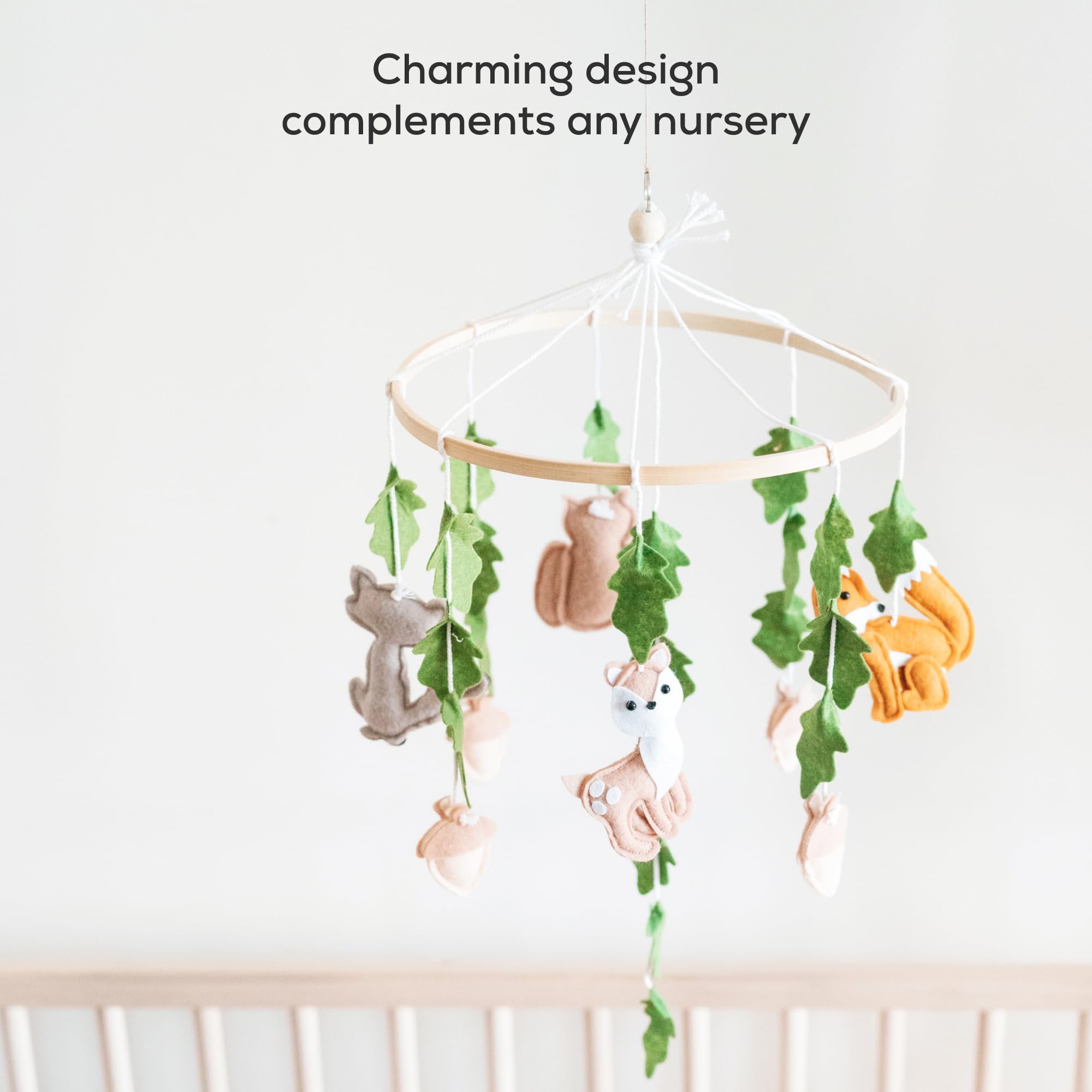 First Landings crib mobile hand-sewn from eco-friendly felt for plush textures.