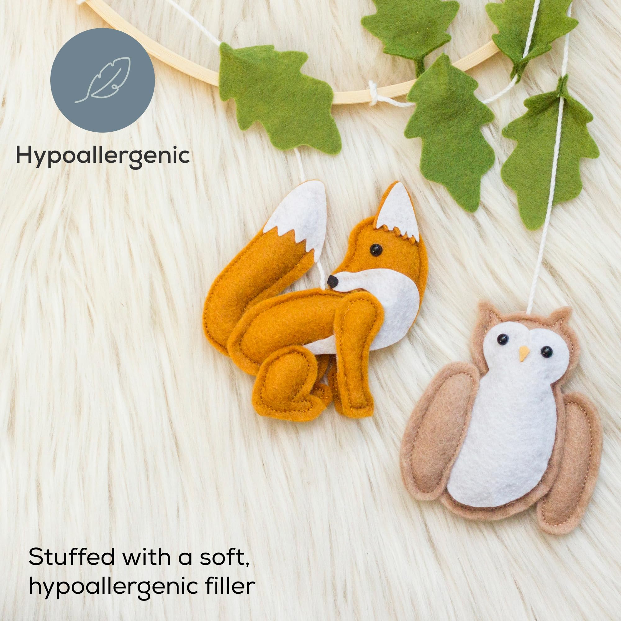 First Landings forest animal mobile with a raccoon for soft, hypoallergenic play visuals.