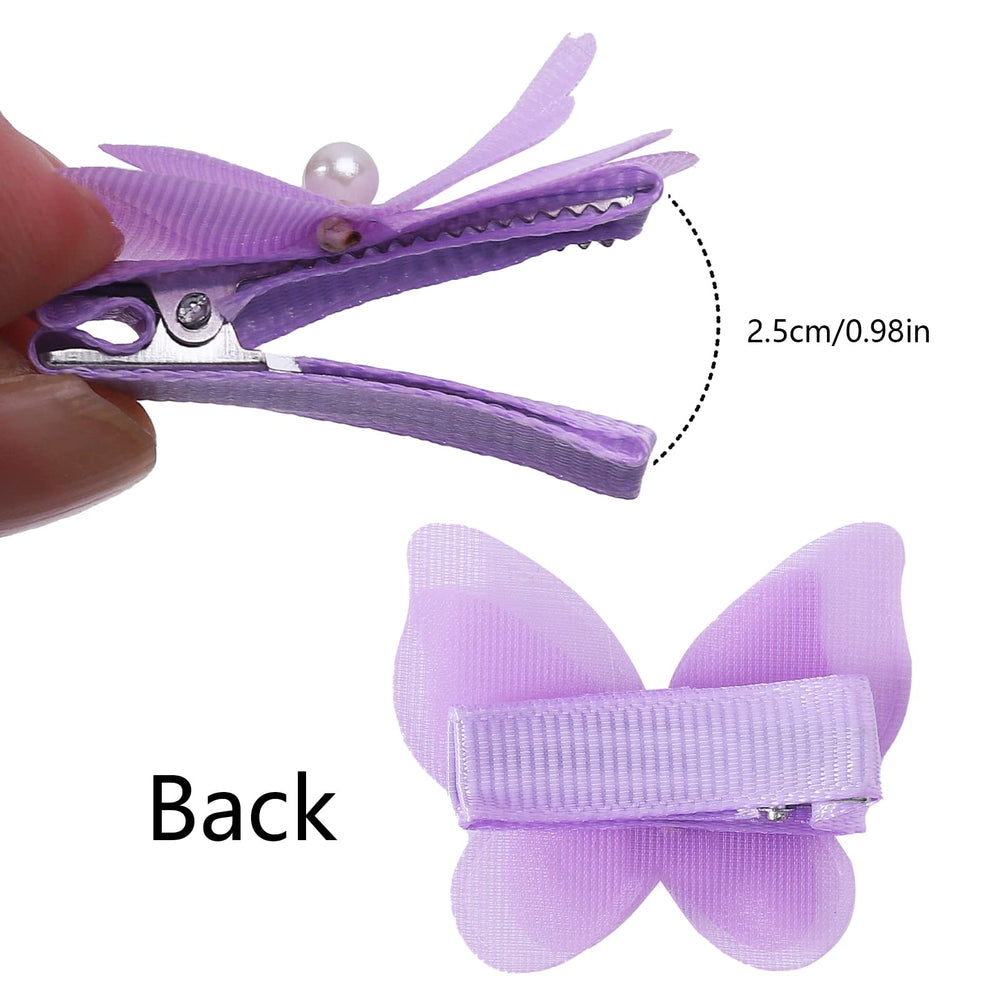 Fishdown 3D butterfly wing clip in white complements formal looks.
