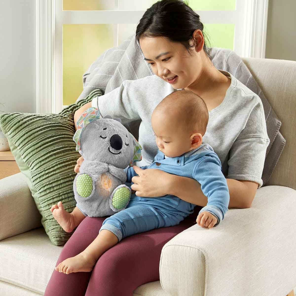 Fisher-Price Koala plush textures invite gentle tactile exploration.