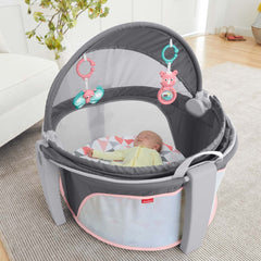 Fisher-Price baby dome with overhead toys encourages eye tracking and exploration.
