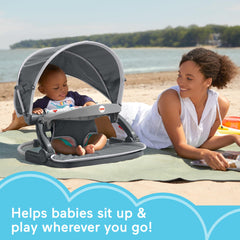 Fisher-Price travel baby chair canopy shields sun during outdoor play