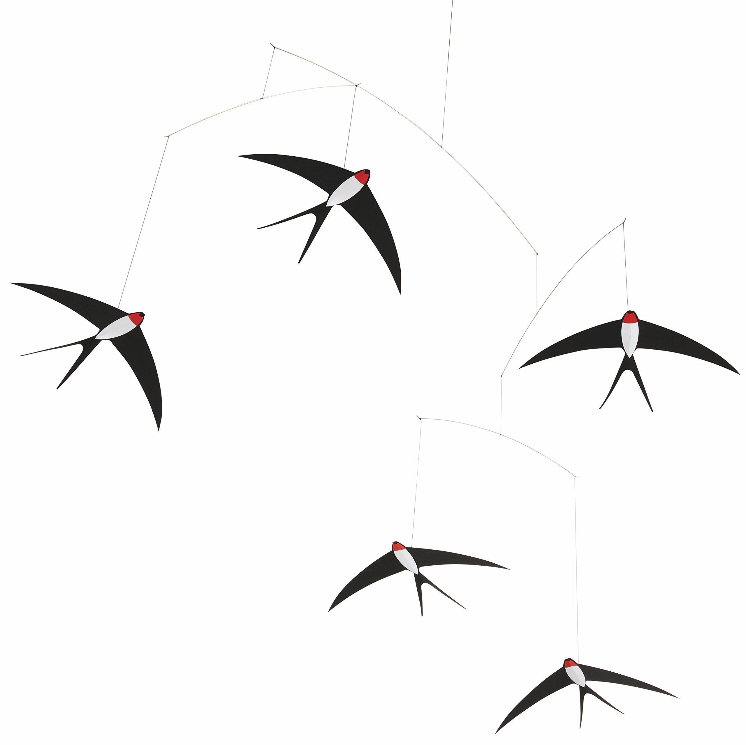 Flensted 5 swallows mobile hanging over bed for calming ambience.