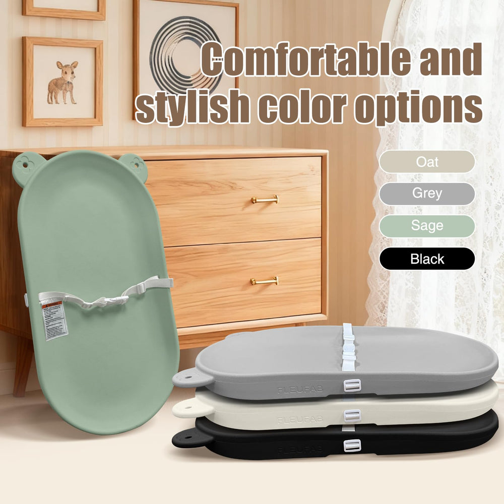 FLEUFAB changing pad in green finish complements nursery decor