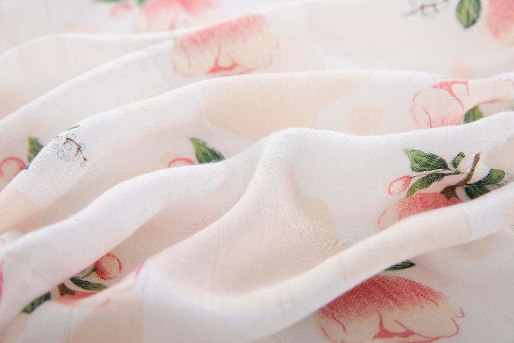 Soft, breathable Flexora Pink Dreams swaddle for nap time and stroller shade.