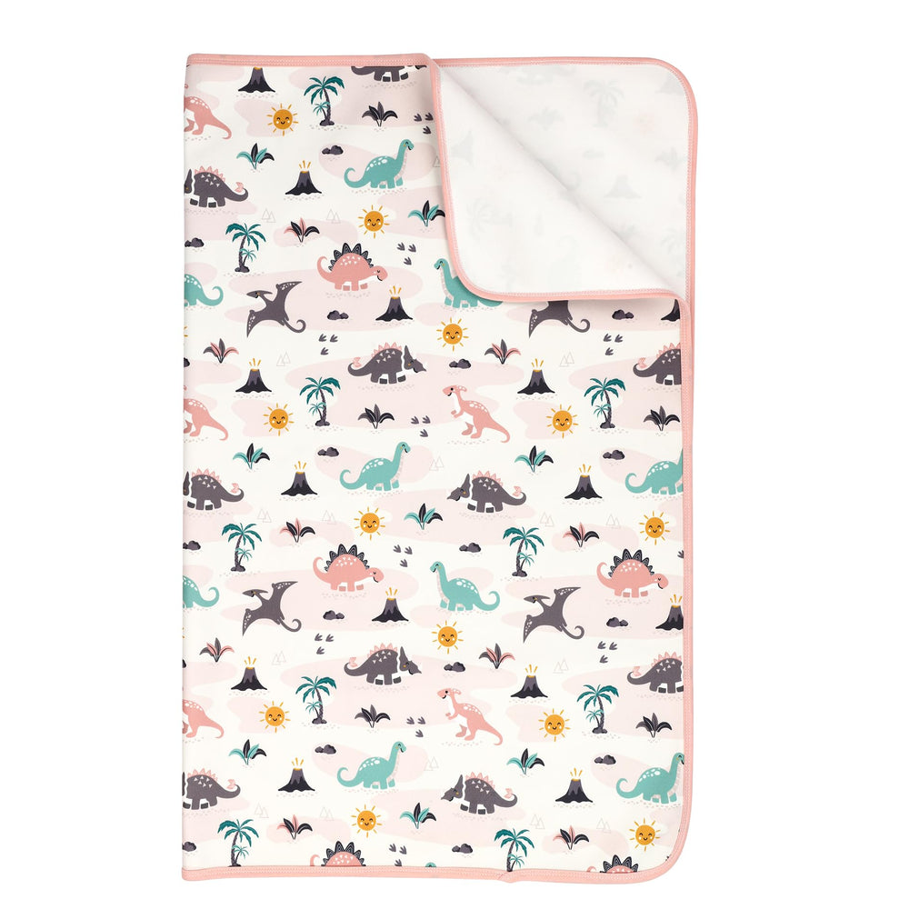 Florith dinosaur-pattern bed-underpad for cozy, waterproof night protection.