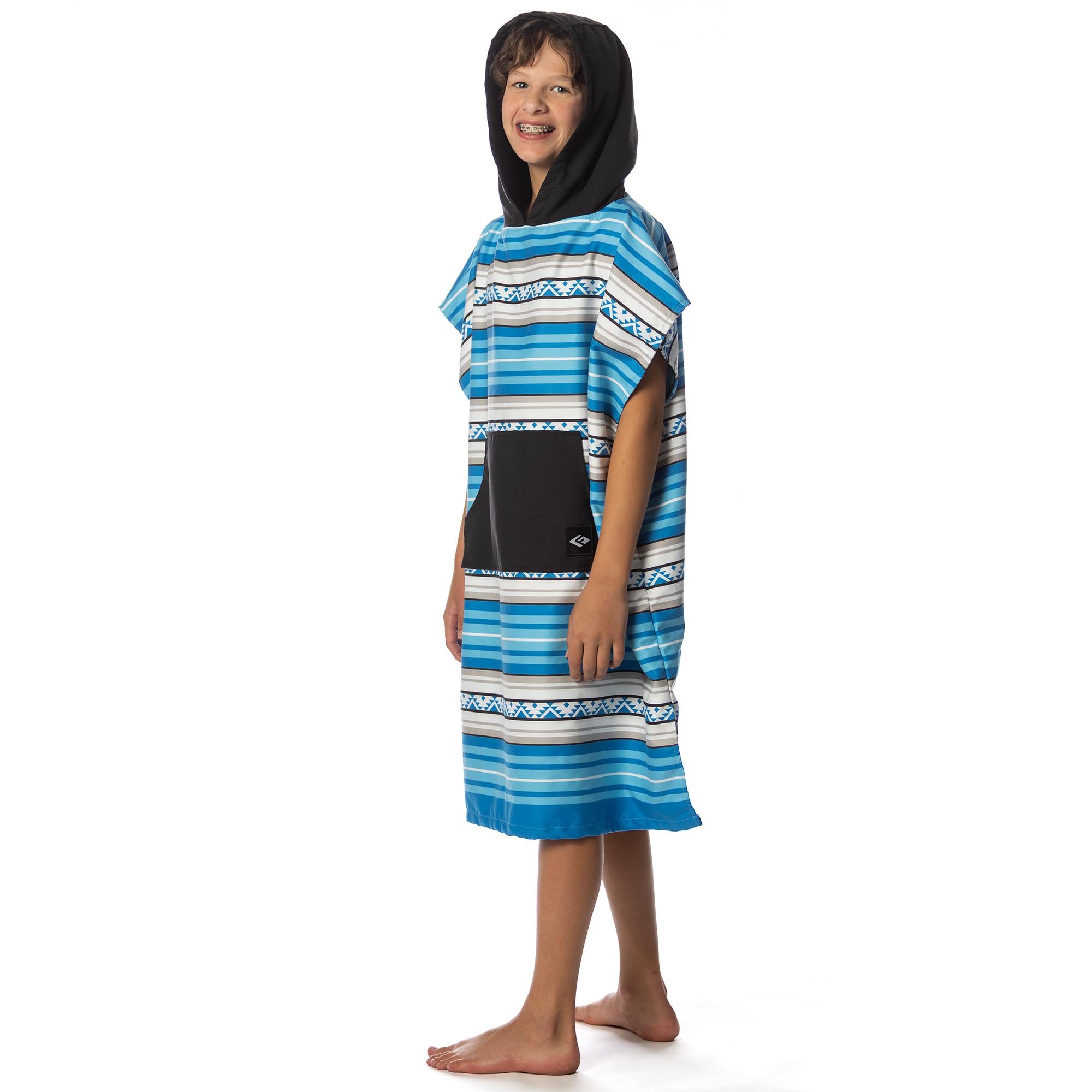 Flow Changing Poncho for Kids Laguna Blue inside gear bag ready to pack