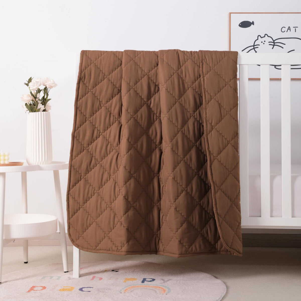 FLXXIE coffee microfiber toddler comforter folded, lightweight and cozy for travel.
