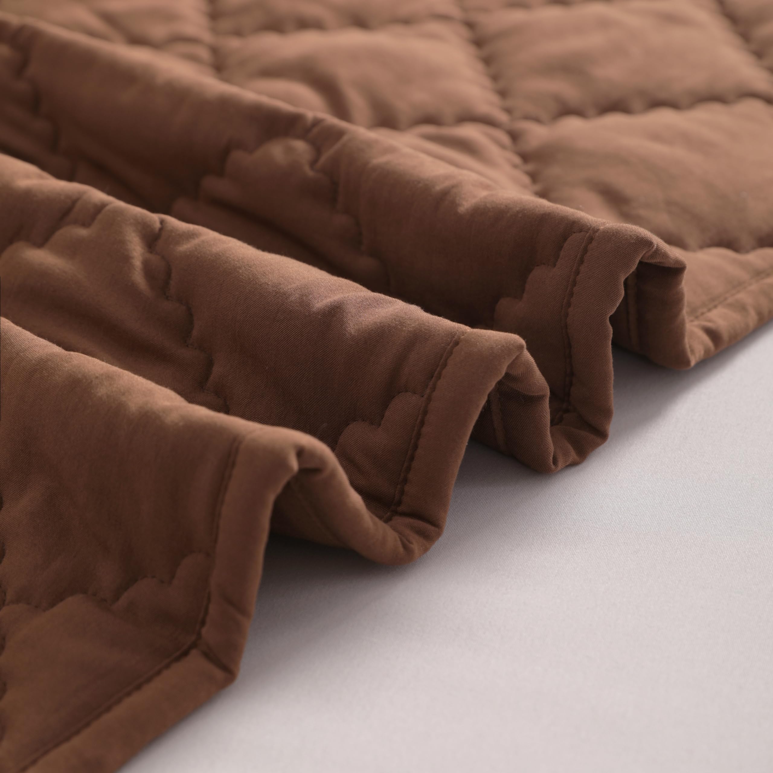 FLXXIE coffee quilted detail closeup, breathable microfiber and durable stitching.