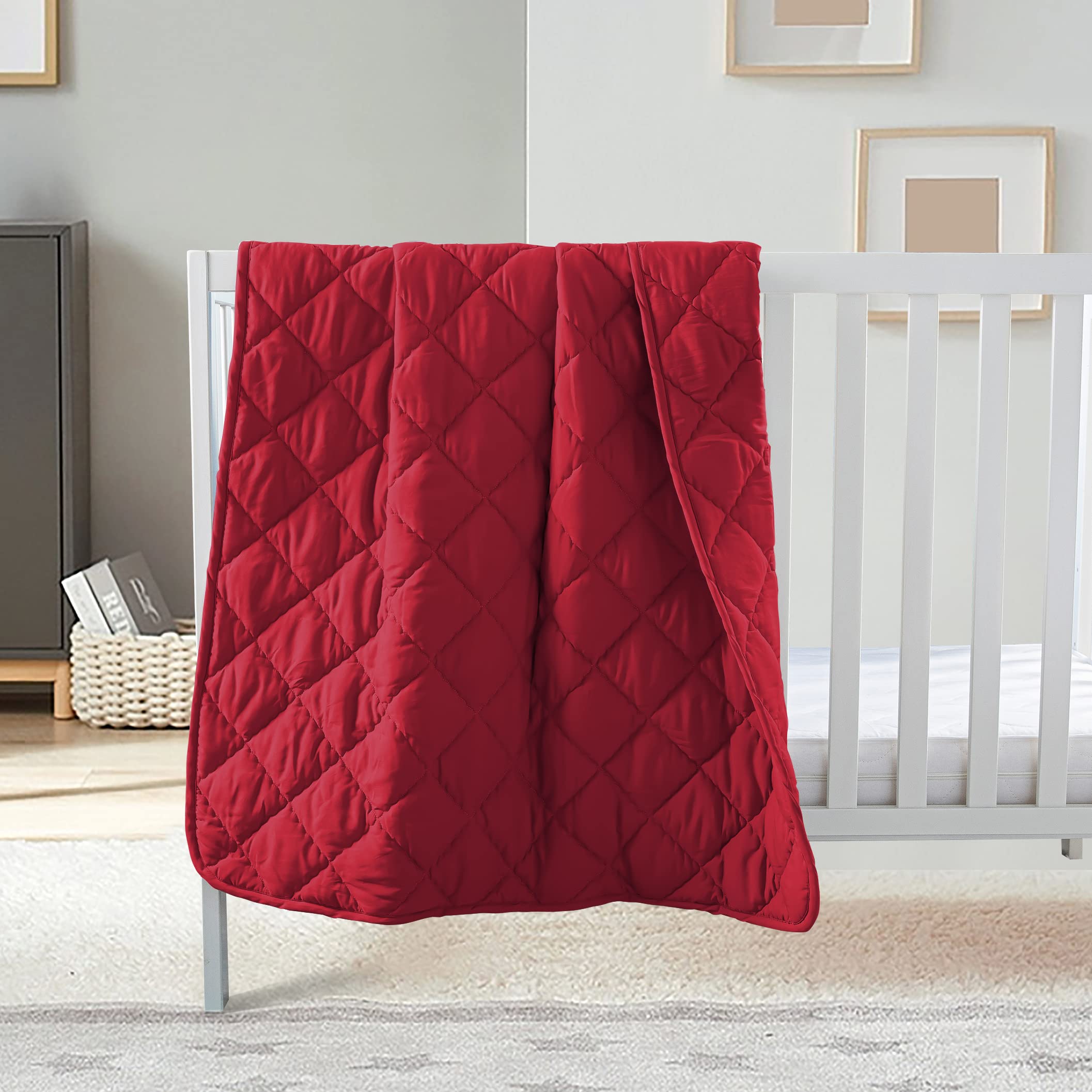 FLXXIE comforter in red color for cozy crib and stroller use.
