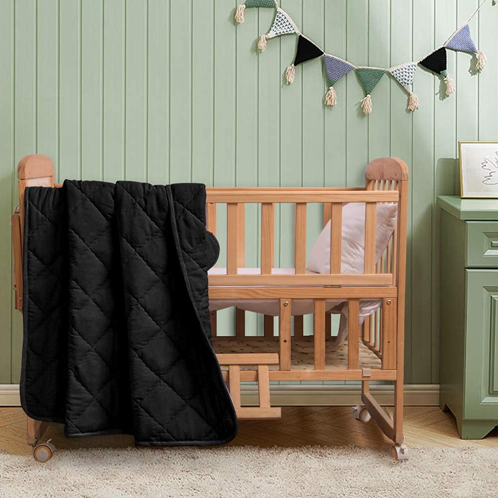 FLXXIE down-alternative blanket close-up shows lightweight, breathable fabric.