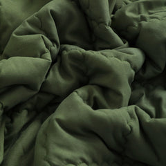 FLXXIE olive comforter spread on crib or bed for cozy, decorative styling