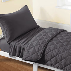 FLXXIE quilt close-up shows soft microfiber comfort for cozy toddler nights.