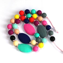 Flyaway chew necklace with breakaway clasp close-up demonstrates safety design for kids.