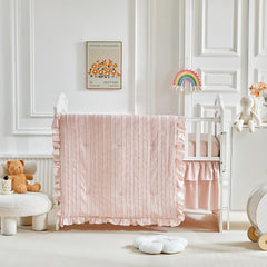 Flysheep crib skirt provides a neat finish beneath the mattress.