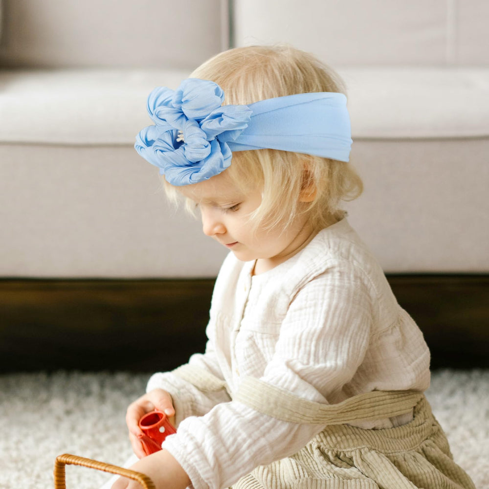 Fmeida blooming bow headband blue style highlighted in a fashion shot