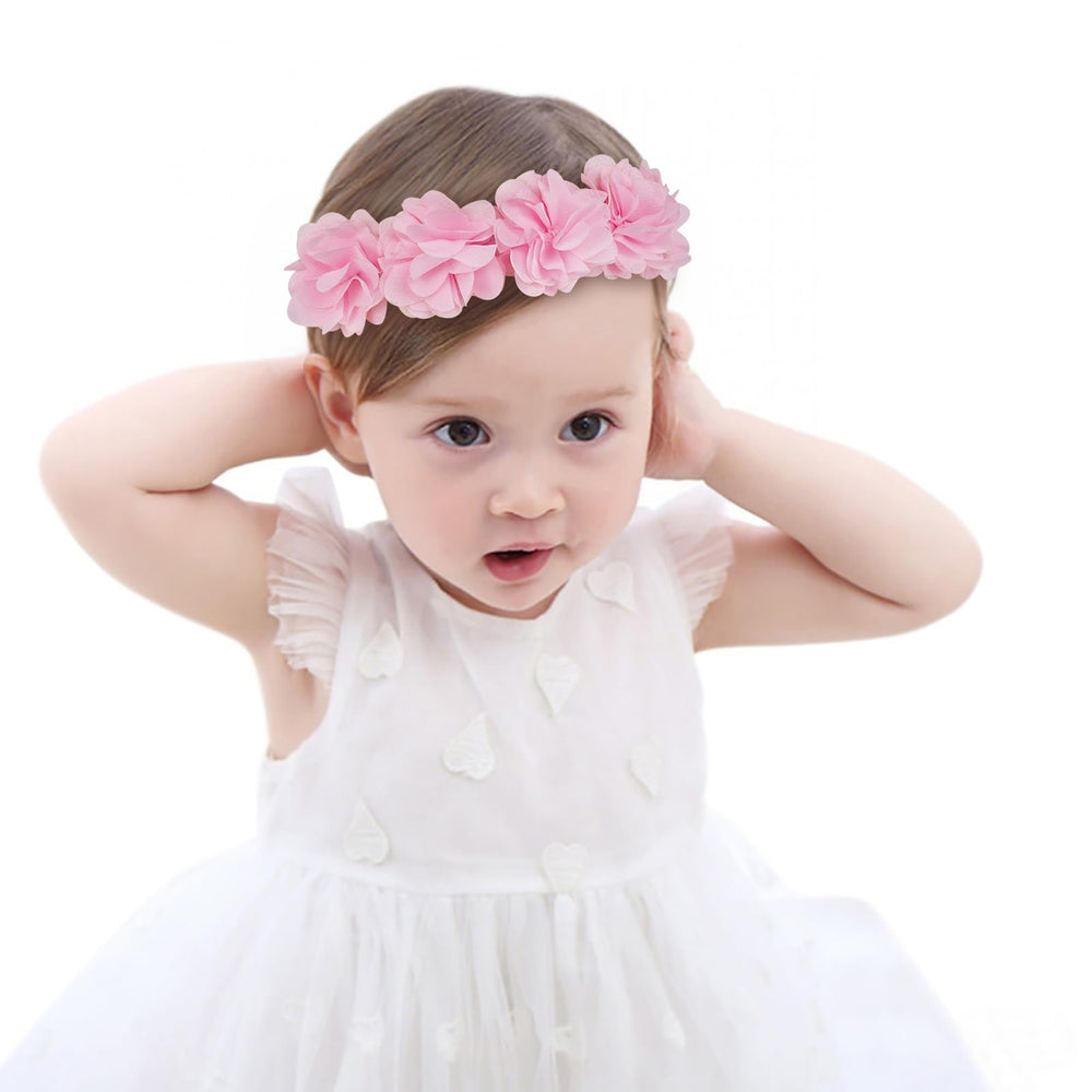 Fmeida soft pink flower headband on a baby girl; ideal photography prop